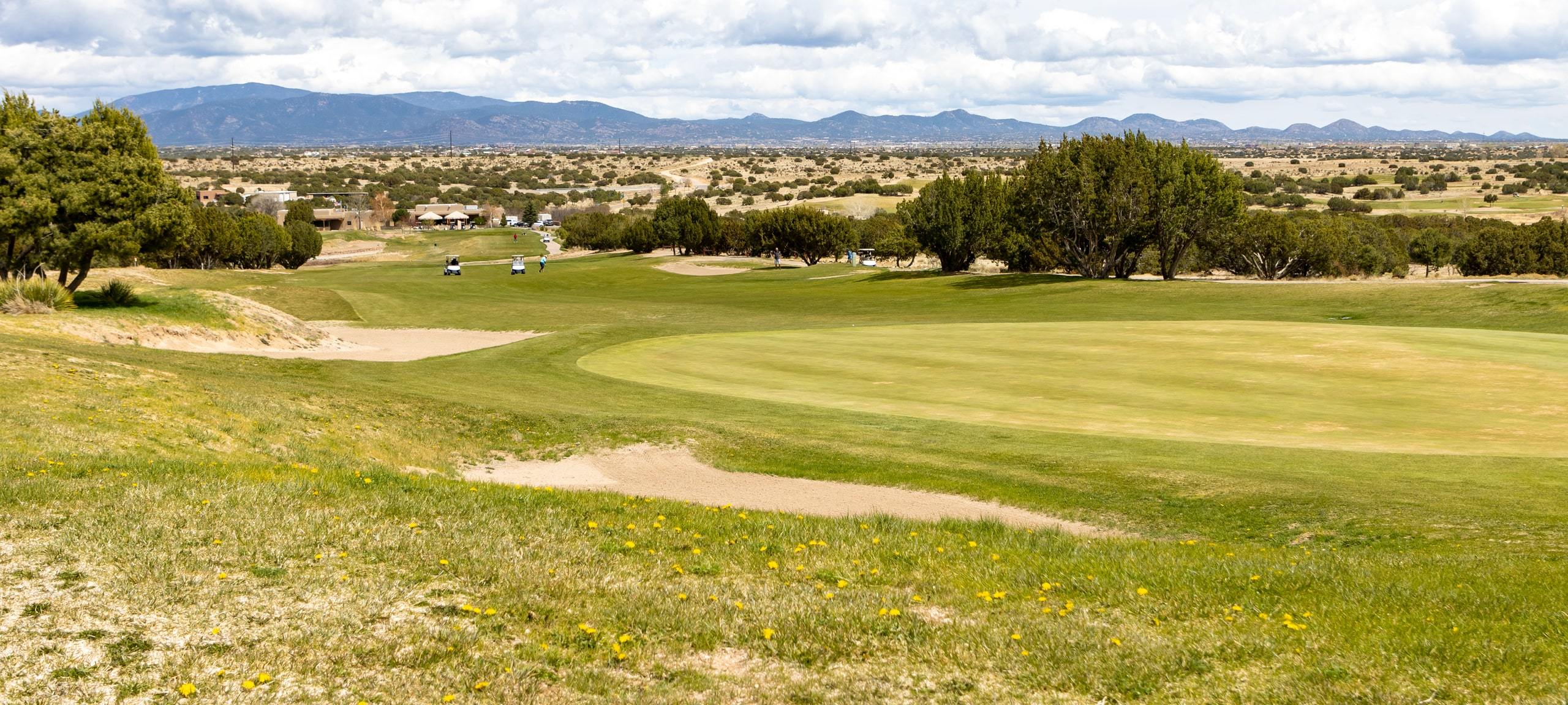 Golf course and mountain ranges, typical of Las Campanas, NM
