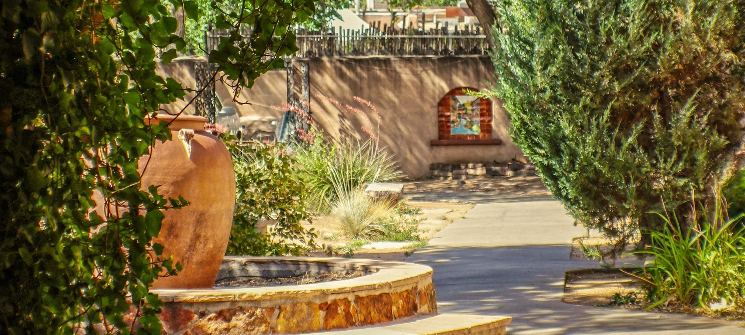 Adobe style home courtyard with fountain in Santa Fe, NM